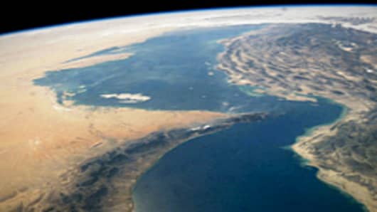 This satellite image shows the Strait of Hormuz, between the Persian Gulf and the Gulf of Oman. The Strait of Hormuz runs between Iran and United Arab Emirates.