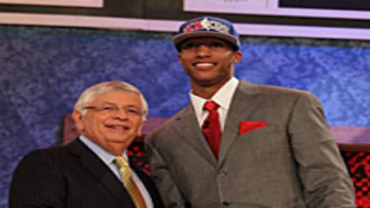 Evan Turner of Ohio State stands with NBA Commisioner David Stern after being drafted by the Philadelphia 76ers second overall at Madison Square Garden on June 24, 2010 in New York City.