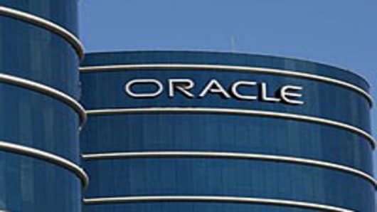 The Oracle logo is displayed on the company's world headquarters in Redwood Shores, California.