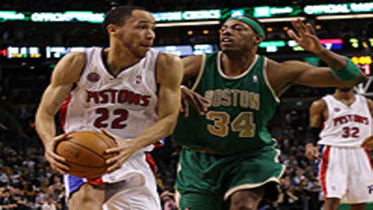 Tayshaun Prince #22 of the Detroit Pistons heads for the net as Paul Pierce #34 of the Boston Celtics.