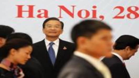 China's Premier Wen Jiabao waits for other leaders to arrive for a group photo during the 16-nation East Asia Summit, which the US is attending for the first time along with Russia, on the sidlines of the 17th Association of Southeast Asian Nations (ASEAN) Summit in Hanoi October 30, 2010.