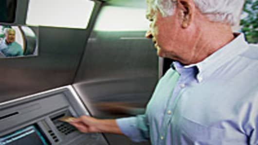 Senior using ATM machine