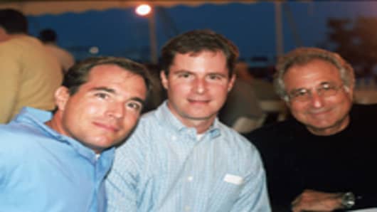 Financier Bernard Madoff (R) with his sons Mark Madoff (L) and Andrew Madoff (C) during July 2001 in Montauk, NY.