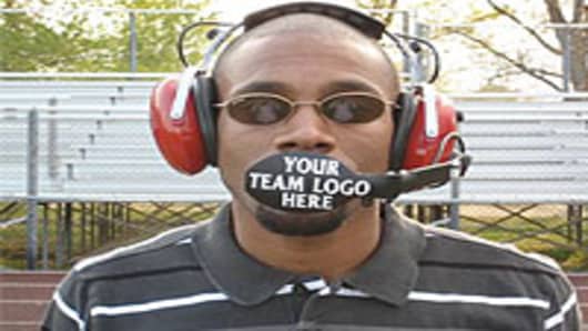 Inventor, Ramone Ward with his patented BoomGuard microphone shield for sports that require headsets.