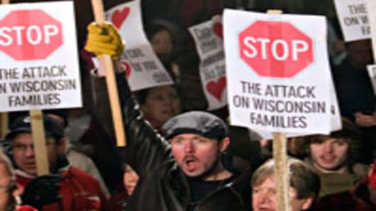 Protesters fill the courtyard and steps outside the State Capitol building on February 16, 2010 in Madison, Wisconsin. Protesters were demonstrating against Wisconsin Gov. Scott Walker's proposal to eliminate collective bargaining rights for many state workers.