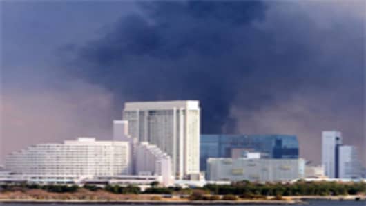 Smoke rises from a construction site due to the strong earthquake on March 11, 2011 in Tokyo, Japan. A magnitude 8.9 strong earthquake hit the northeast coast of Japan.