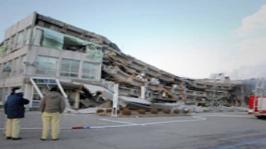 A factory building has collapsed in Sukagawa city, Fukushima prefecture, in northern Japan. A massive 8.9-magnitude earthquake shook Japan, unleashing a powerful tsunami that sent ships crashing into the shore and carried cars through the streets of coastal towns.