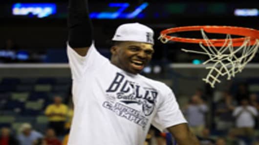 Shelvin Mack #1 of the Butler Bulldogs celebrates defeating the Florida Gators 74 to 71 in overtime