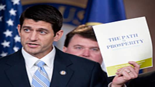 House Budget Chairman Paul Ryan, R-Wisc., holds a copy of his budget proposal 'The Path to Prosperity' during a news conference on the FY2012 budget resolution on Tuesday, April 5, 2011.