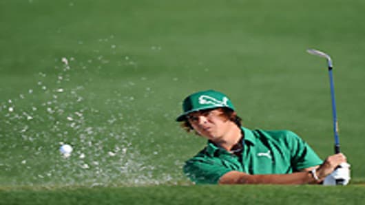 Rickie Fowler plays from a bunker on the second hole during the first round of the 2011 Masters Tournament at Augusta National Golf Club on April 7, 2011.