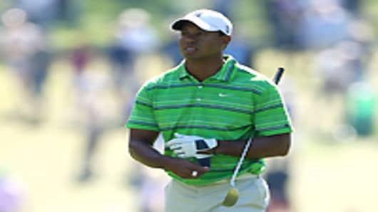 Tiger Woods walks up the first hole during the first round of the 2011 Masters Tournament at Augusta National Golf Club on April 7, 2011 in Augusta, Georgia.