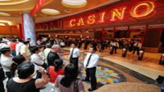 Visitors wait to enter Singapore's first casino at the Resorts World Sentosa complex in Singapore on February 14, 2010. Singapore's first casino opened for business when the first punter was allowed into the gaming section of the Sentosa complex. The opening -- to be followed within months by a second casino resort -- is part of a multi-billion-dollar effort to transform Singapore's tourism industry.
