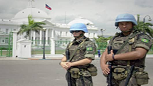 Brazilian army soldiers acting as U.N. peacekeepers in front of the presidential palace in Port-au-Prince, Haiti.