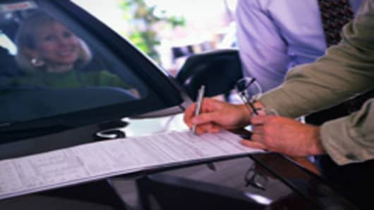car_hood_signing_paperwork_200.jpg