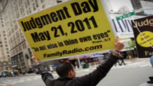 Participants in a movement that is proselytizing that the world will end this May 21, Judgment Day, gather on a street corner on May 13, 2011 in New York City. The Christian based movement, which claims thousands of supporters around the country and world.