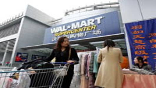 A Chinese customer leaves after shopping at Beijing's first Wal-Mart supercenter October 14, 2006 in Beijing, China. Wal-Mart workers in China have set up unions at all 62 Chinese outlets in what a senior Chinese trade union official described on October 12th as a breakthrough for organized labor.