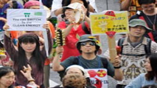 People march on the street during an anti nuclear demonstration in Tokyo on June 11, 2011.