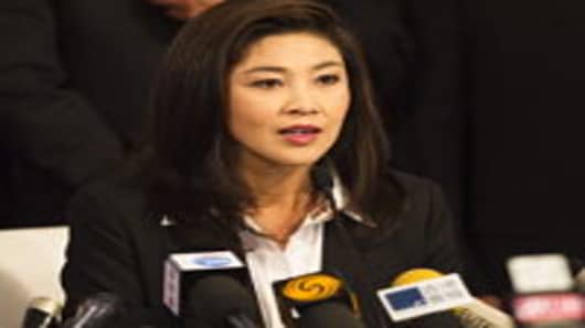 Yingluck Shinawatra, the opposition Puea Thai party candidate and sister of fugitive Thai ex-prime minister Thaksin Shinawatra, speaks during a press conference after becoming the Southeast Asian kingdom's first female prime minister.