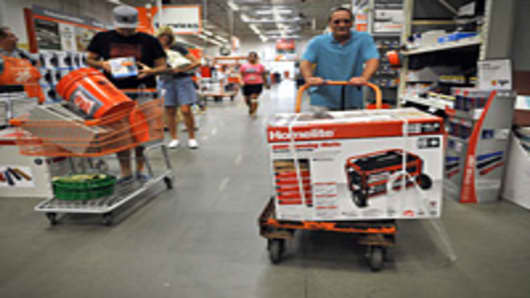 A man pushes a cart with a generator at a Home Depot store in Kitty Hawk in the North Carolina Outerbanks ahead of the expected landfall in the area of Hurricane Irene.