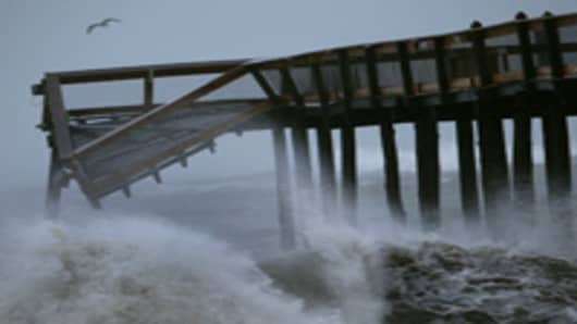 Large waves from Hurricane Irene pound the Ocean City pier, on August 28, 2011 in Ocean City, Maryland.