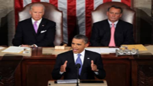 U.S. President Barack Obama, flanked by Vice President Joe Biden and Speaker of the House John Boehner, addressed both houses of the U.S. legislature to highlight his plan to create jobs for millions of out of work Americans on September 8, 2011 in Washington, DC.