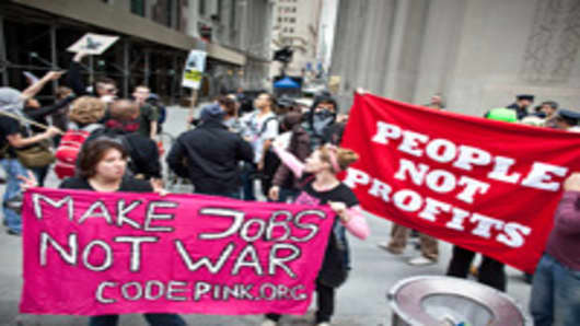 Demonstrators rally on Wall Street in lower Manhattan in New York, U.S., on Saturday, Sept. 17, 2011.