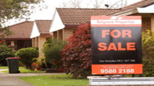 'For Sale' sign is seen outside a property in Sydney, Australia.