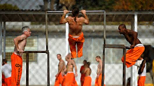 Inmates at Chino State Prison exercise in the yard December in Chino, Calif.