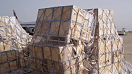 Pallets of cash unloaded on to the tarmac at Baghdad International Airport.