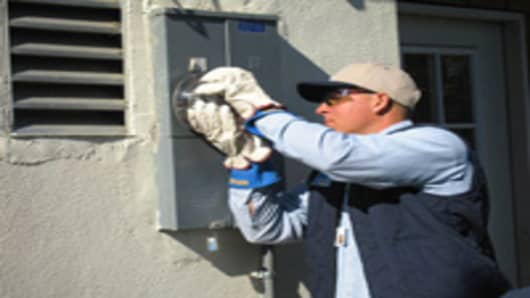 PG&E employee installing a smart meter in California.