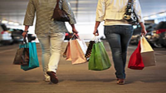 Two women walking to car after shopping