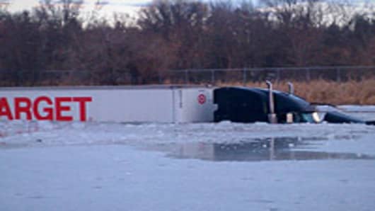 Target Semi-truck went off I-94 near Monticello into icy pond.