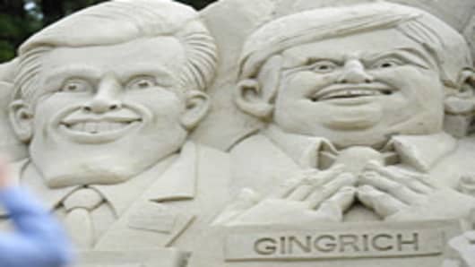 A sand sculpture picturing Republican presidential hopefuls (L-R) Mitt Romney and Newt Gingritch is set in front of the Myrtle Beach Convention Center ahead of a Republican debate in Myrtle Beach, South Carolina, on January 16, 2012