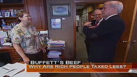 Warren Buffett's assistant Debbie Bosanek speaks with NBC's Tom Brokaw in this frame grab from a 2007 report on Buffett's call for higher taxes on the super-rich.