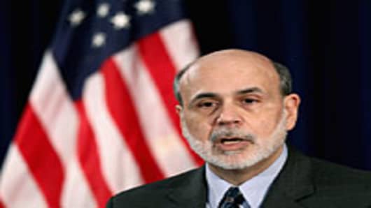 Federal Reserve Chairman Ben Bernanke speaks during a press conference announcing that the Fed will take no action on interest rates at the Federal Reserve Bank on January 25, 2012 in Washington, DC