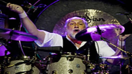 Mick Fleetwood of Fleetwood Mac perform on stage.