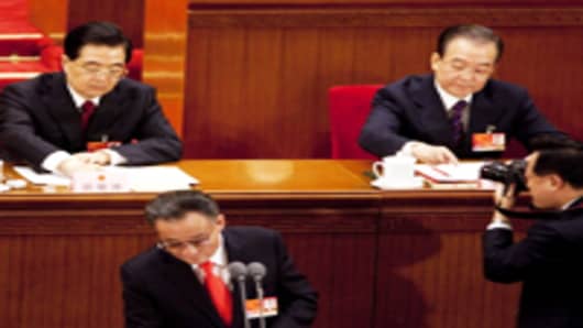 Hu Jintao, China's president (L) and Wen Jiabao, China's prime minister (R) and Wu Bangguo, chairman of the National People's Congress (NPC), attend the National Party Congress in 2011.