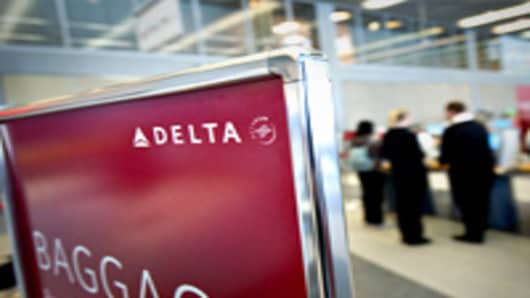 Passengers check in for Delta Air Lines