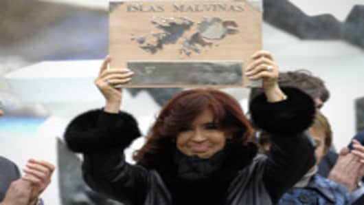 Argentine President Cristina Fernandez de Kirchner holds a plaque before delivering a speech during a ceremony to mark the 30th Anniversary of the 1982 South Atlantic war between Argentina and the Britain over the Falkland Islands (Malvinas).