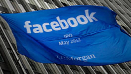 A Facebook Inc. IPO announcement flag flies outside of JPMorgan Chase & Co. headquarters in New York.
