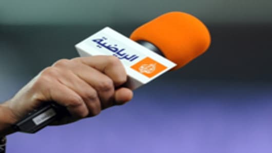 A microphone with the logo of Qatar-based broadcaster Al Jazeera.