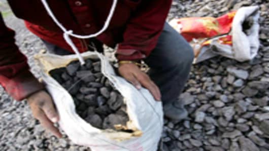 A bag of coals picked out from gangue stockpiles at a coal-chosen factory in Chifeng of Inner Mongolia Autonomous Region, China.