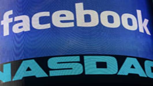 A sign welcoming Facebook is flashed on a screen outside the NASDAQ stock exchange at Times Square in New York.