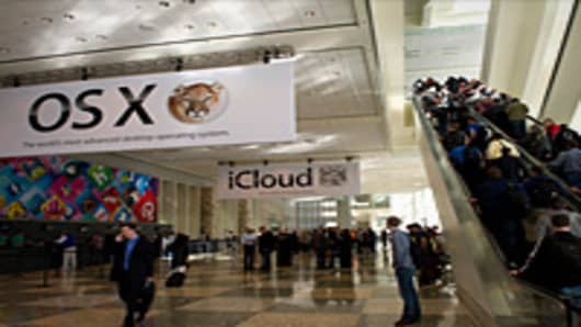 Attendees line up to enter Moscone West ahead of the Apple Worldwide Developers Conference in San Francisco, California.