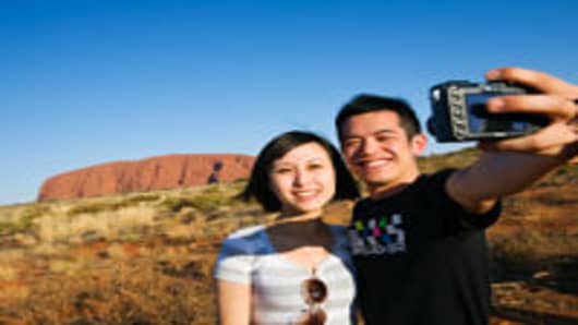 Chinese tourists at Uluru (Ayers Rock), UluruKata Tjuta National Park, Northern Territory, Australia