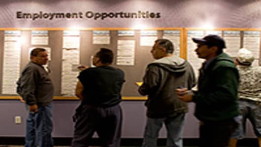 People check the jobs board at a Denver Workforce Center, part of the Denver Office of Economic Development, in Denver, Colorado, U.S.