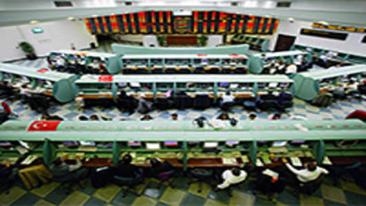 Traders work on the floor of the Istanbul Stock Exchange in Istanbul, Turkey.