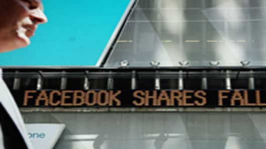 A news ticker announces the falling share price of Facebook in Times Square on August 16, 2012 in New York City. Shares of Facebook fell today on the NASDAQ stock exchange on the first day insiders were allowed to sell their shares.