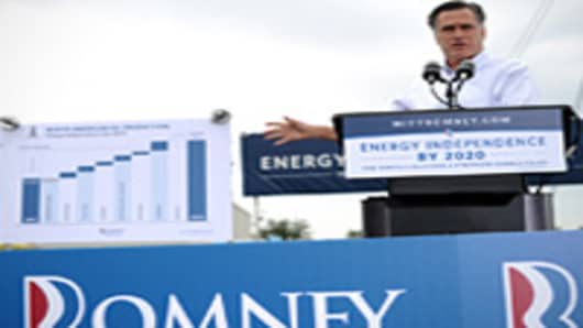 US Republican presidential candidate Mitt Romney shows a chart as he speaks during campaign event at Watson Truck and Supply in Hobbs, New Mexico, on August 23, 2012.