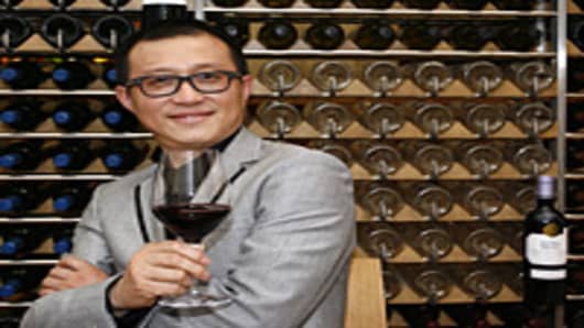 Dongjun Shen, group managing director of Chinese jewelry group Tesiro, poses on March 1, 2011, in a winebar in Bordeaux, in the world-renowned Bordeaux' wines region, southwestern France, after his group bought the 'cru bourgeois' Chateau Laulan Ducos in the Medoc area.